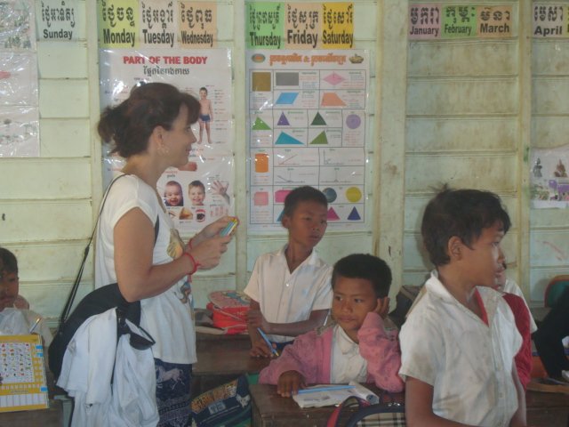 A photo of the tourist and Kompong Phluk, Cambodia children