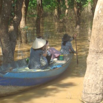 Two women navigating the waterways in the Flooded Forest