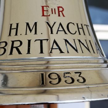 LEITH, SCOTLAND, UK : 2 MARCH 2019 : The Original Ships Bell dated 1953 hanging on the after deck of Her Majesty's Yacht Britannia