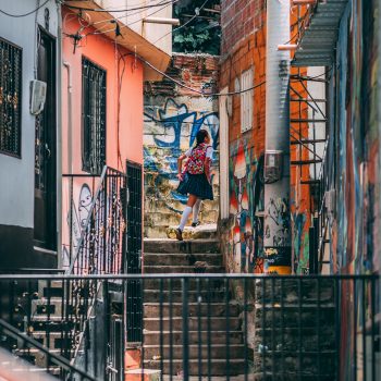 A girl rounding a corner in Comuna 13
