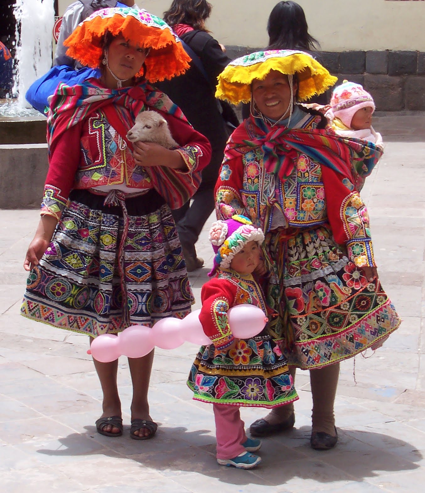 Women clad in traditional clothes on the street of Cusco, Peru.