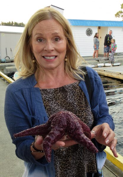 Ed's wife holding a starfish in Nanaimo, Vancouver Island.