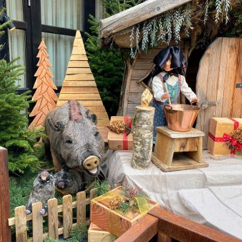 A Christmas display with a crafted wild boar