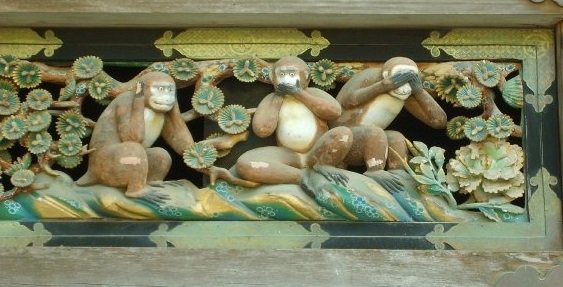 A statue of three monkeys mimicking the hear no evil, speak no evil, see no evil phrase in Japan.