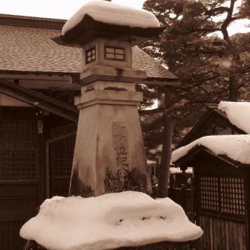 A snow-capped entrance statue in Japan