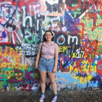 Kate Clark in front of Prague Lennon Wall