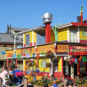 A colorfully painted wharf restaurant.