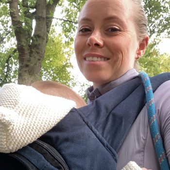 A selfie of Kristen and her baby outdoors