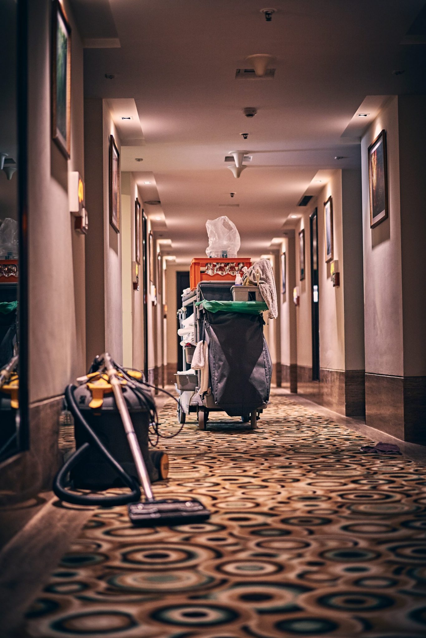 A hotel cleaner's cart, front line workers helping people to quarantine after flying