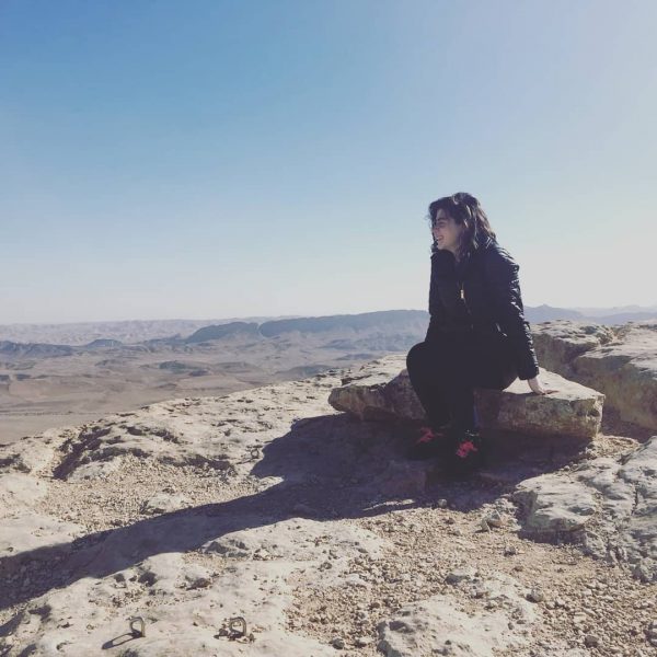 Alana sitting in the sun at Makhtesh Ramon, Israel