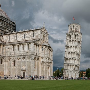 The Leaning Tower of Pisa in front of a stormy backdrop