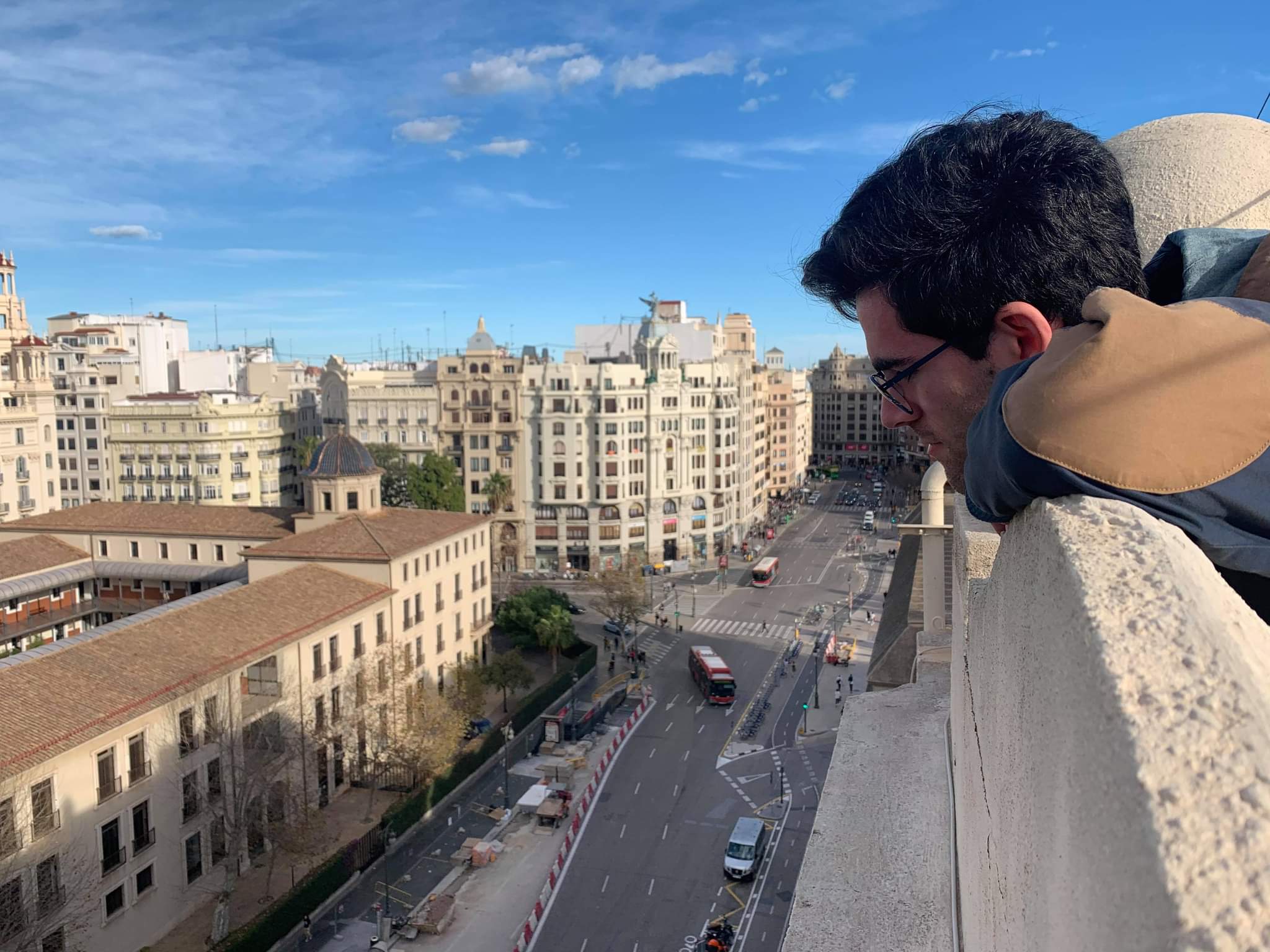 Kevin Mascitelli looking down at the street from the roof.