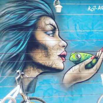 A mural or a woman kissing a frog in Tel Aviv, Israel, which Alana saw on her trip with Hillel.